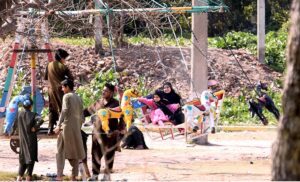 Children enjoy swing in a local park at Kuri Road