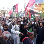 Workers of People's Party celebrating on the victory of President-elect Asif Ali Zardai outside Punjab Assembly