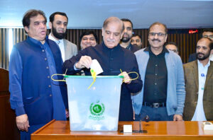 Prime Minister Muhammad Shehbaz Sharif casts his vote in the Senate by-elections at the Parliament House.