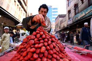 Vendor selling and displaying strawberries to attract the customers at Fawara Chowk during Ramadan.