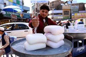 Vendor selling and displaying fresh cheese to attract the customers during Ramadan.