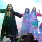 Students performing in tableau on the stage during annual function of the local school at Mehran Art Council