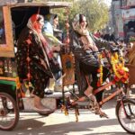 People enjoy riding tricycle rikshaw at Food Street.