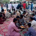 Peoples breaking fast (Iftar) during Holy month of ramadan at Latifabad