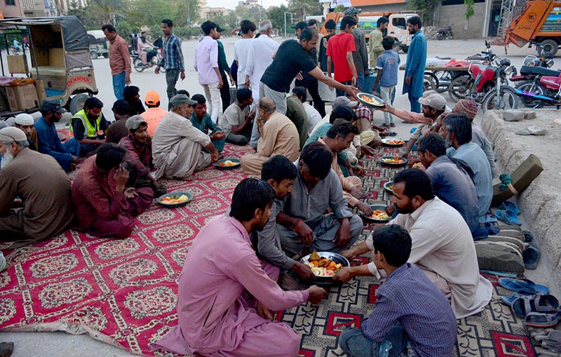 Peoples breaking fast (Iftar) during Holy month of ramadan at Latifabad