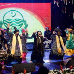 Famous folk singer Arif Lohar with his team performing on stage during function to mark Punjab Culture Day at Alhamra
