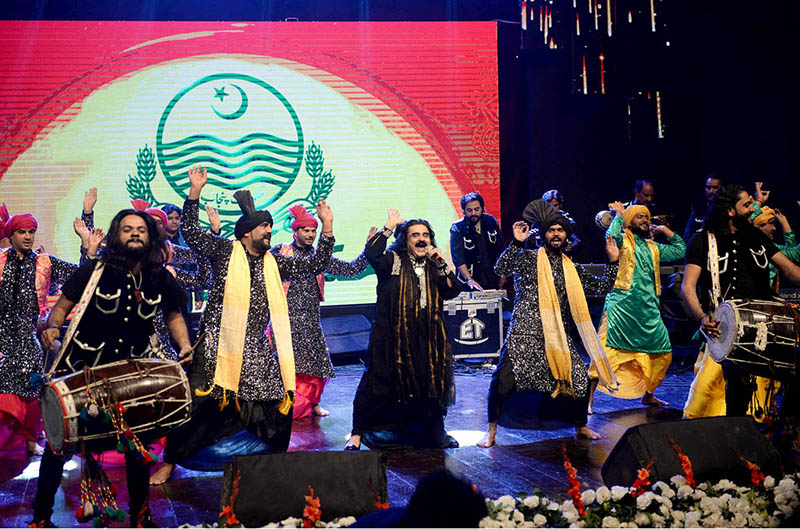 Famous folk singer Arif Lohar with his team performing on stage during function to mark Punjab Culture Day at Alhamra