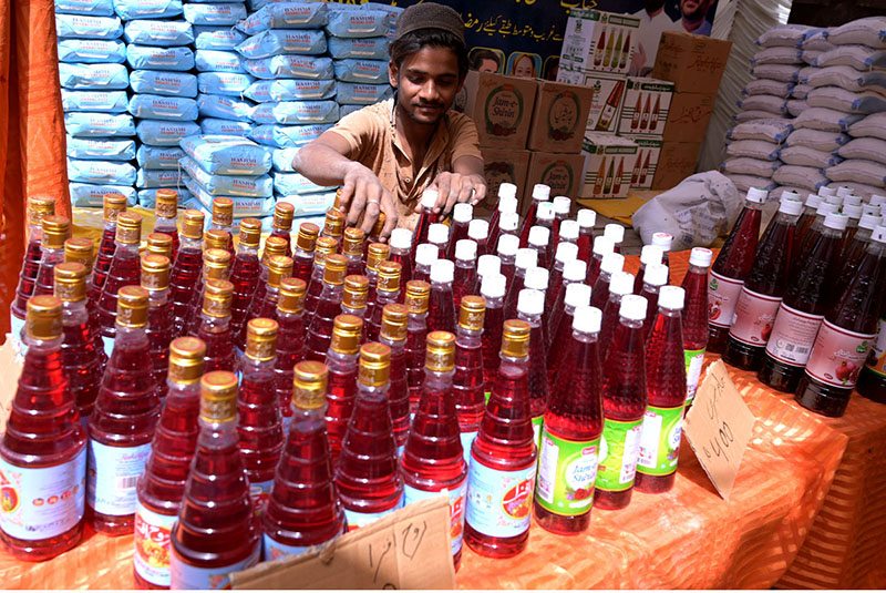 A vendor displaying juices to attract the customer in Ramzan bachat bazaar organized by local government at Tower market.