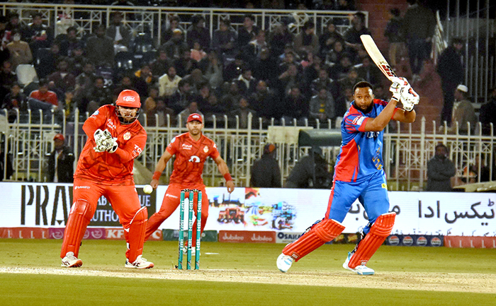 Karachi Kings batter, Kieron Pollard plays shot during the Pakistan Super League (PSL) Twenty20 cricket match at the Rawalpindi Cricket Stadium.