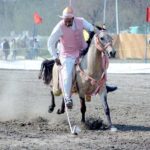A rider in action during tent pegging championship organized by University of Agriculture Faisalabad (UAF) at Sports Ground in connection with Spring Festival celebrations.