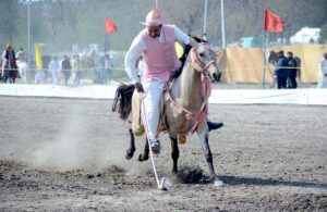 A rider in action during tent pegging championship organized by University of Agriculture Faisalabad (UAF) at Sports Ground in connection with Spring Festival celebrations.