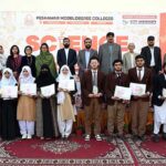 Female student busy in calligraphy during Science and Art exhibition arranged by Peshawar Model Degree Colleges