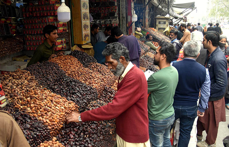 Vendors are busy in arranging and displaying different kinds of dates for selling on the arrival of Holy Month Ramadan