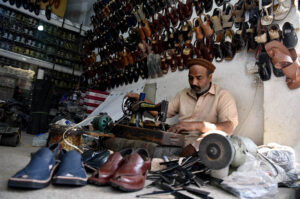 Cobbler Making Peshawari Chappal for Eid Shopping at Kohati Bazar.