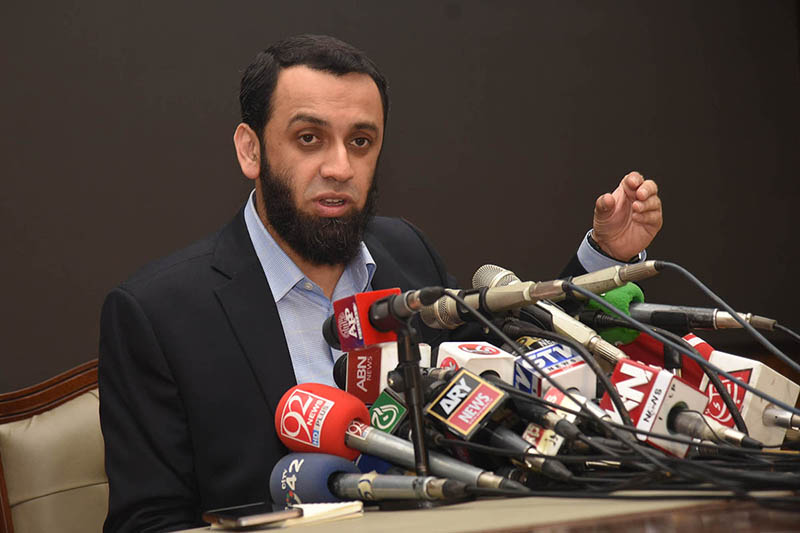 Federal Minister for Information and Broadcasting, Attaullah Tarar addressing a press conference at 180 h Model Town