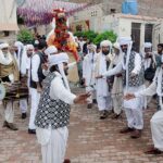 Artists performing traditional dance during a function to mark Baloch Culture Day