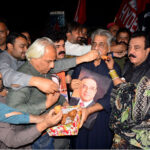 Workers of People's Party celebrating on the victory of President-elect Asif Ali Zardai outside Press Club