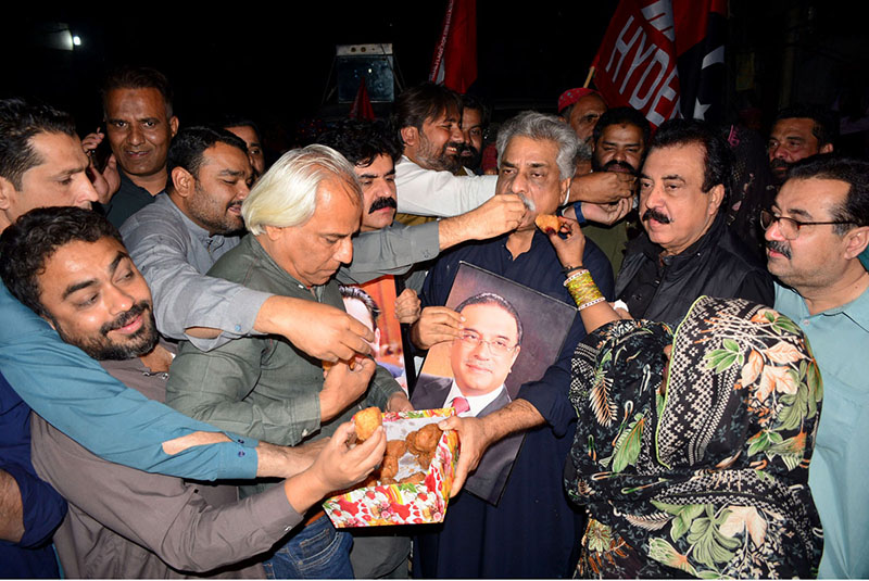 Workers of People's Party celebrating on the victory of President-elect Asif Ali Zardai outside Press Club