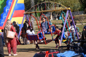 Children’s are enjoying the swings at Race Course Park