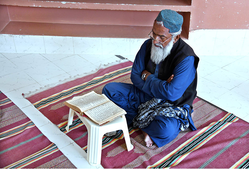 Students reciting verses of Holy Quran in a local madrasa at Dodai Road during Holy Fasting Month of Ramzan