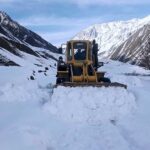 Heavy machinery being used to remove snow from the blocked road of Mir Malik area Astore Valley