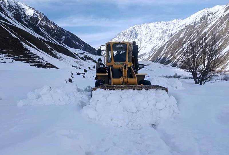 Heavy machinery being used to remove snow from the blocked road of Mir Malik area Astore Valley