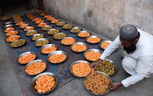Volunteer organize Iftari for faithful to break their fasting during the Holy Fasting Month of Ramzan at Madarsa Jamia Ishatul Quran Wal-Hadees Dodai Road.
