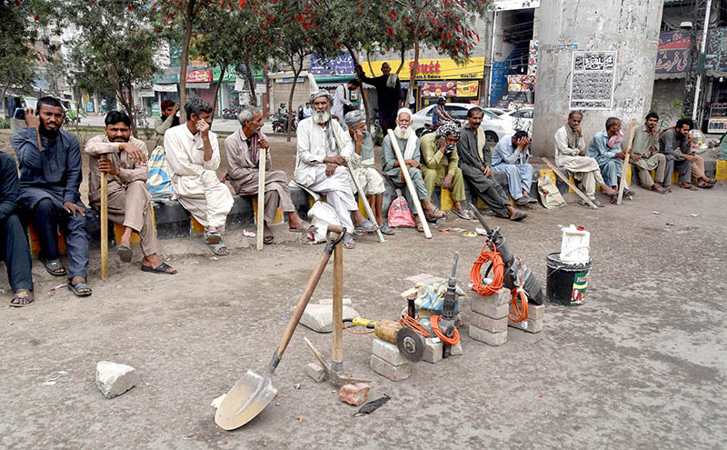 The daily wage laborers sitting at Chobarji Chowk waiting to get job for livelihood.