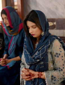 Christian women pray as they attend the Easter service at Don Busco Church.