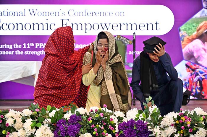 Students performing on stage in drama during National Women Conference in connection with International Women’s Day at National Library.