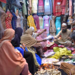 Women shopping clothes in cloth market in preparations of Eid-ul-Fitr in the city