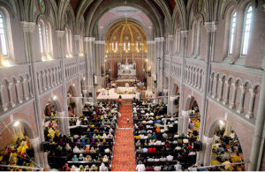 Christian women pray as they attend the Easter service at Don Busco Church.