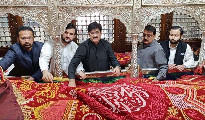 Chief Minister Sindh Syed Murad Ali Shah laying wreath on the grave of Hazrat Lala Shahbaz Qalandar on the occasion of 772nd Urs celebration on last day