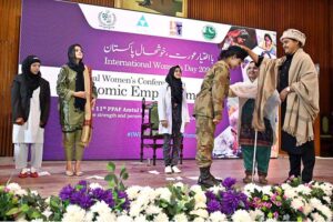 Students performing on stage in drama during National Women Conference in connection with International Women’s Day at National Library.