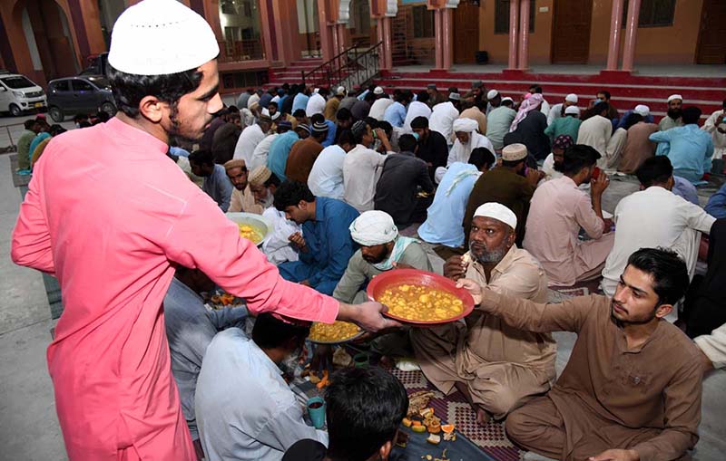 Volunteer organize Iftari for faithful to break their fasting during the Holy Fasting Month of Ramzan at Madarsa Jamia Ishatul Quran Wal-Hadees Dodai Road.