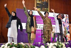 Students performing on stage in drama during National Women Conference in connection with International Women’s Day at National Library.