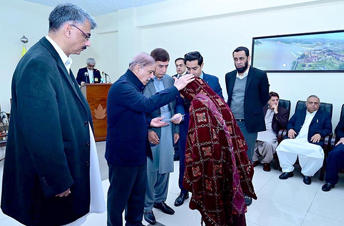Prime Minister Muhammad Shehbaz Sharif distributing assistance cheques among the families of the deceased and injured in the wake of recent torrential rains and heavy snowfall.
