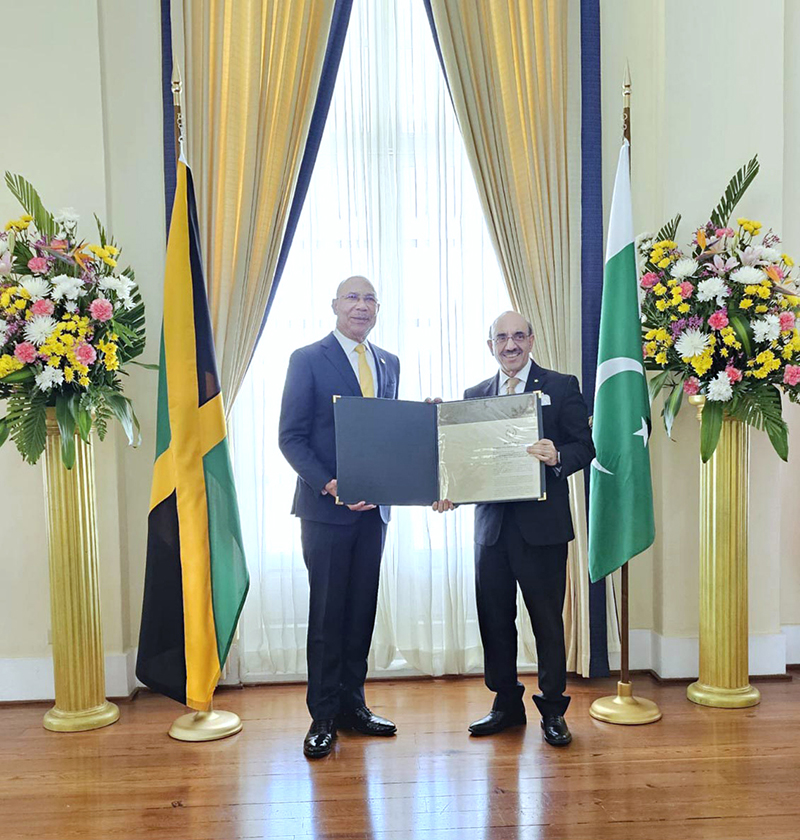 Ambassador Masood Khan presenting Letter of Credence as Non-Resident High Com- missioner to the Most Honorable Sir Patrick Linton Allen, Governor General of Jamaica.