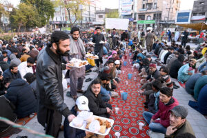 Volunteers preparing food to distribute among the people in fast during the Holy Month of Ramadan at Satellite Town.