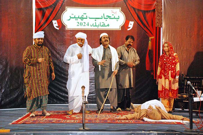 - Artists performing on stage during Drama Theater Competition 2024 organized by Punjab Council of the Arts Council.