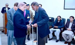 Prime Minister Muhammad Shehbaz Sharif distributing assistance cheques among the families of the deceased and injured in the wake of recent torrential rains and heavy snowfall.