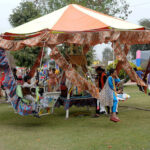 Children enjoying swing during the Jashn-e-Baharan festival organized by PHA at Qasim Bagh
