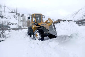 Heavy machinery being used to remove snow and boulders from the blocked road of Astore Valley by the staffer of Gilgit-Baltistan Disaster Management authority and Works Department after heavy sonw fall and rain in area caused land sliding in diffident area
