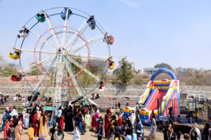 Students enjoy camel ride during Annual Funfair at Model College G10/4.