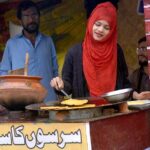 A woman is working hard to earn livelihood in the city while International Women's Day is celebrating over the globe.