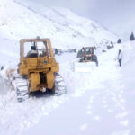 Heavy machinery being used to remove snow and boulders from the blocked road of Astore Valley by the staffer of Gilgit-Baltistan Disaster Management authority and Works Department after heavy sonw fall and rain in area caused land sliding in diffident area