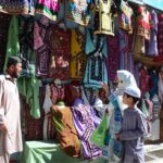 Woman looking for traditional Balochi dresses for Eid-ul-Fitr at Liaqat Bazar