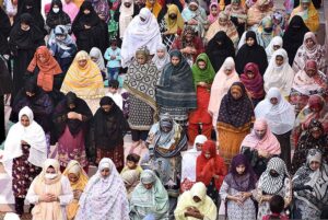 People offer Friday prayers during the Islamic holy fasting month of Ramadan in Historical Badshahi Mosque.