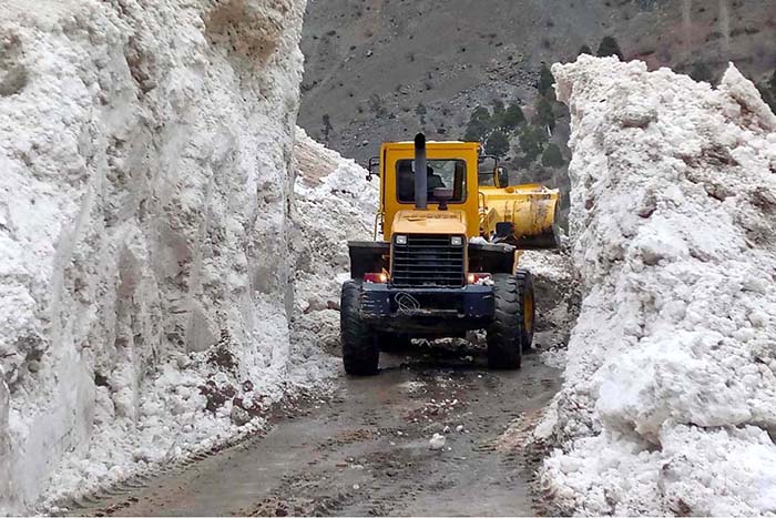 Heavy machinery being used to remove snow from the road of Astore Valley by the staffer of Gilgit-Baltistan Disaster Management Authority and Works Department after heavy sown fall caused land sliding in different area.