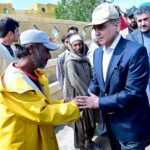 Prime Minister Muhammad Shehbaz Sharif consoling the affectees of torrential rains at a relief camp